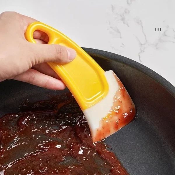Grattoir de cuisine en silicone pour poêles et plats