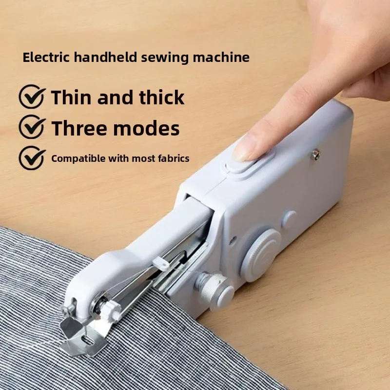 Machine à coudre électrique à main sur un tissu