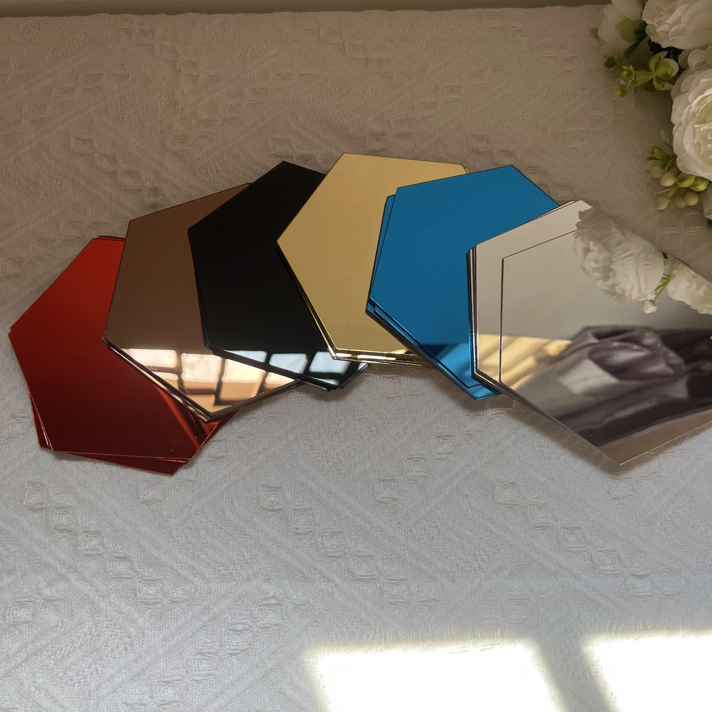 Hexagones miroir bleus, noirs, bruns et or rose