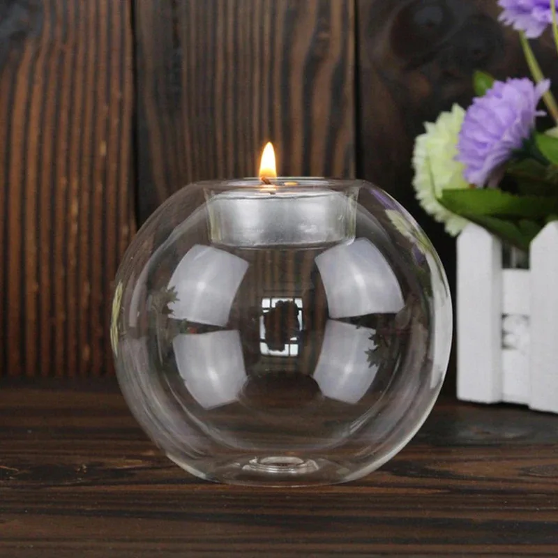 Photophore boule en verre allumé