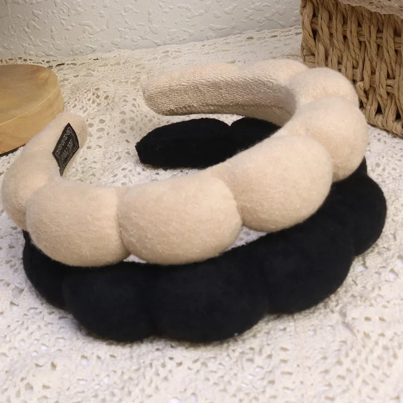 Serre-têtes beige et noir