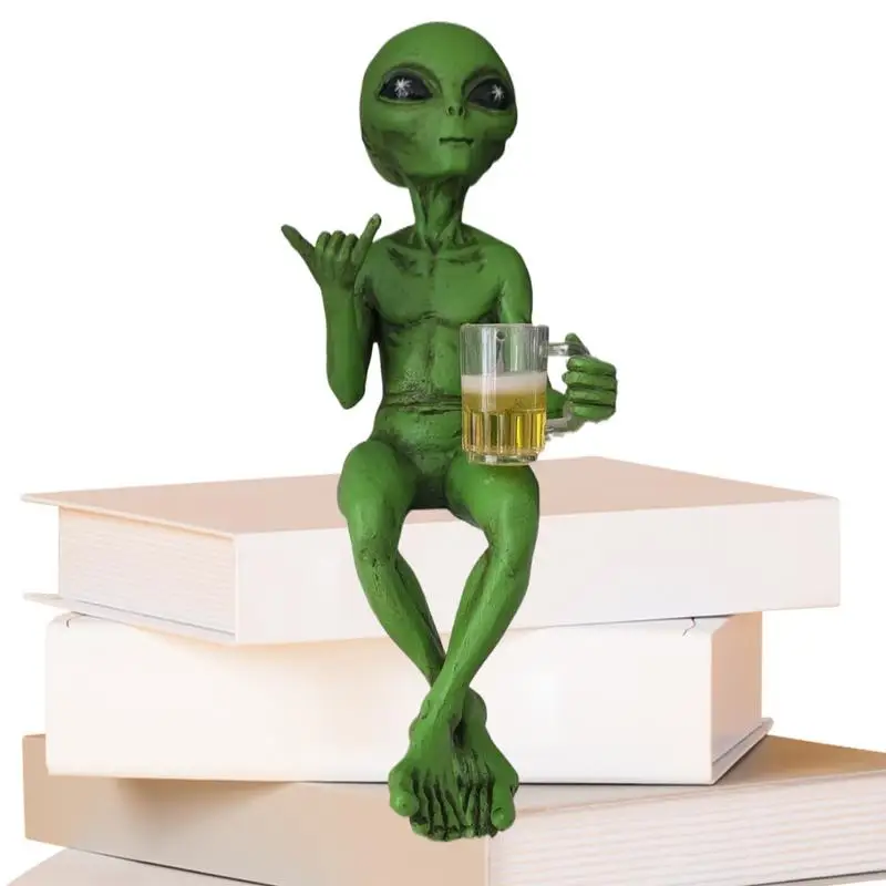 Extraterrestre assis sur des livres